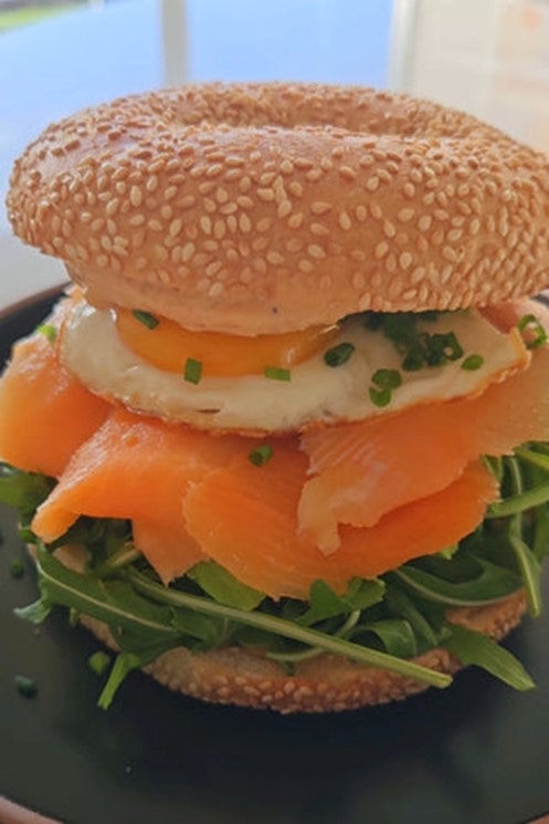 Picture of Salmon Bagel with fried egg, Smoke Gochujang and greens