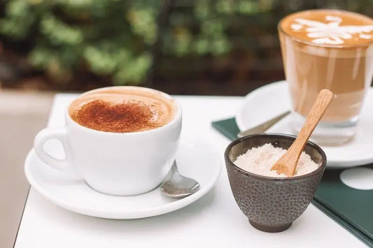 Picture of a cup of coffee with bowl of salt