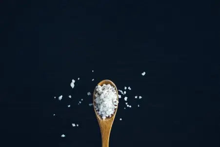 picture of salt in bowl of a spoon