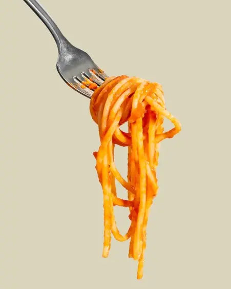 picture of cooked pasta dangling from a fork